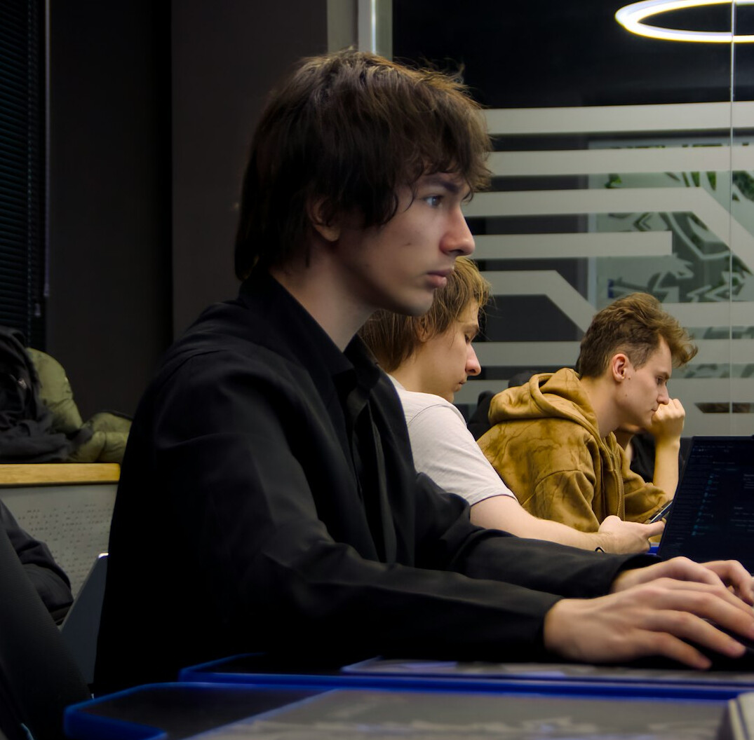 students coding together in class