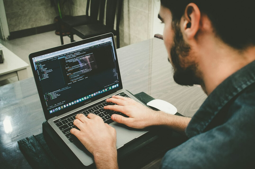 programmer debugging code on screen